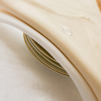 Newgrange swirl on ecru or white Irish linen napkins