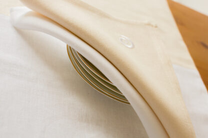 Newgrange swirl on ecru or white Irish linen napkins
