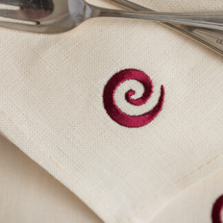 Newgrange swirl in burgundy on ecru Irish linen napkins "limited stock"